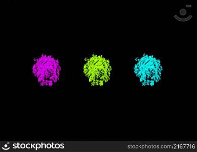 pink green turquoise holi colors arranged row black background