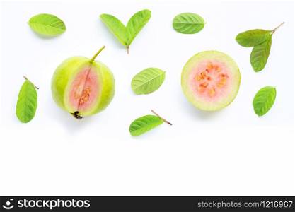 Pink guava with leaves on white background. Copy space