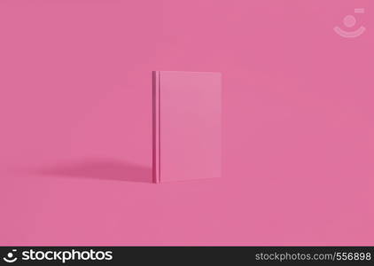 PInk hardcover notebook standing on a matching pastel pink background. Center composition with copy space and room for text.