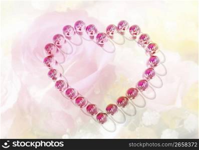Pink heart shape on a rippled pink silky background