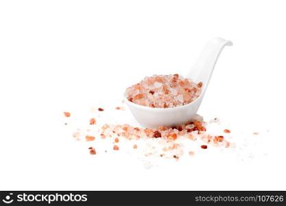 Pink Himalayan salt in ceramic spoon isolated on white background