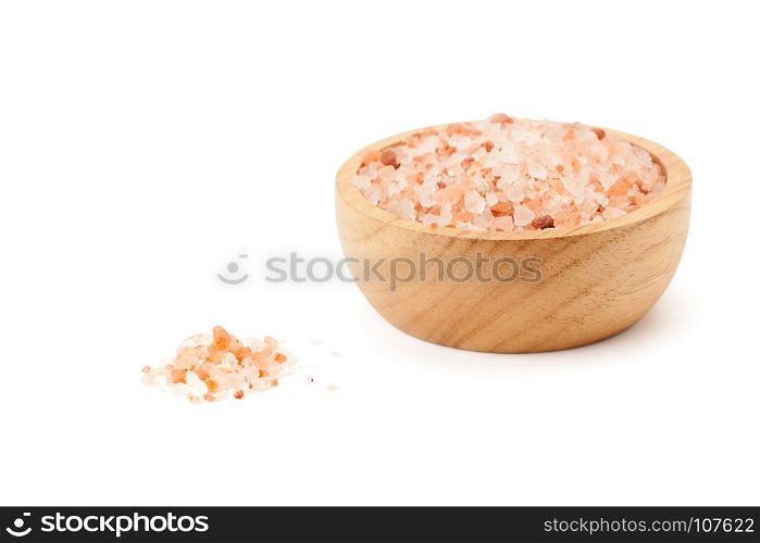 Pink Himalayan salt in wooden bowl isolated on white background