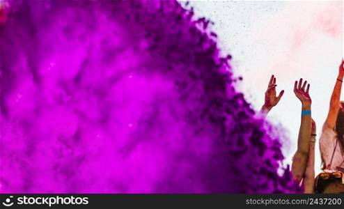 pink holi color powder explode crowd