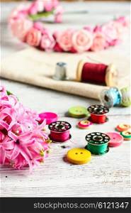 Pink hyacinth and tools for making jewelry for spring. Hyacinth thread decoration