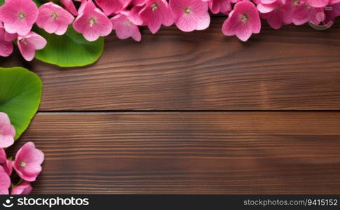 Pink hydrangea flowers on wooden background. Top view with copy space