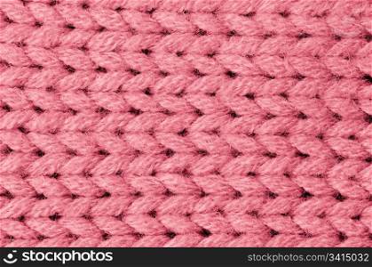 Pink knitted wool texture can use as background.