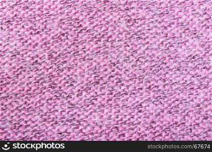Pink knitting fabric texture background or knitted pattern background for design. Knitting or knitted
