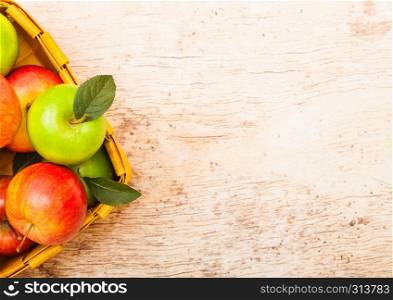 Pink lady royal gala red and granny smith green apples in vintage box on wood background