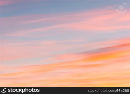 Pink layered clouds as background