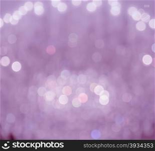 Pink lights festive bokeh background. Defocused christmas lights abstract background
