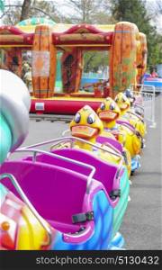 Pink mini train with ducks in amusement park
