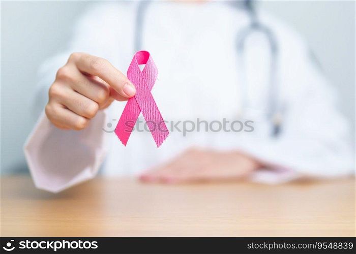 Pink October Breast Cancer Awareness month, woman doctor with pink Ribbon in hospital for support people life and illness. National cancer survivors month, Mother and World cancer day concept
