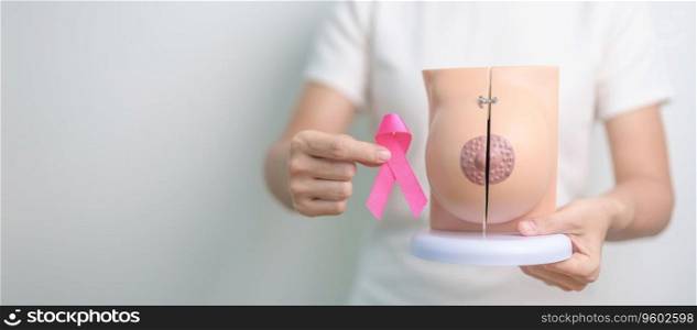 Pink October Breast Cancer Awareness month, woman with pink Ribbon and Breast Anatomy model. National cancer survivors month, health diagnosis, Mother and World cancer day concept
