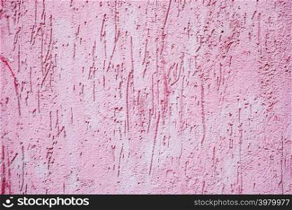 Pink paint rough concrete wall as background or texture