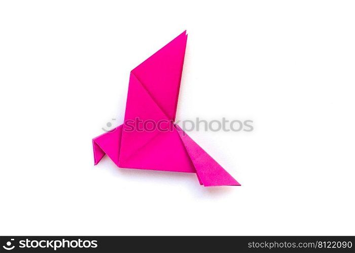 Pink paper dove origami isolated on a blank white background.. Pink paper dove origami isolated on a white background