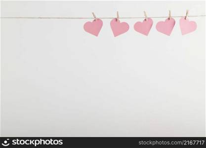 pink paper hearts hanging rope