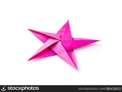 Pink paper star origami isolated on a blank white background.. Pink paper star origami isolated on a white background