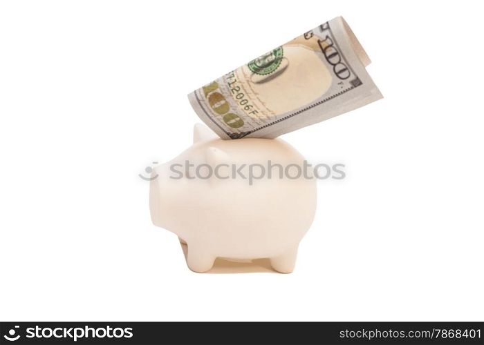 Pink piggy bank and one hundred dollar bill, isolated on white background