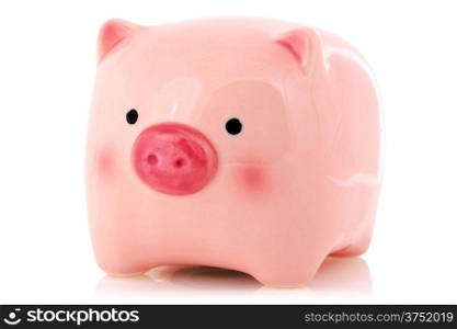 Pink piggy bank with reflection on white background
