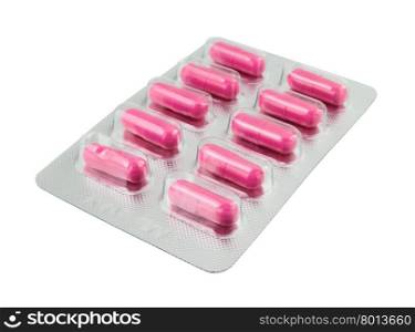 Pink pills pack on white background