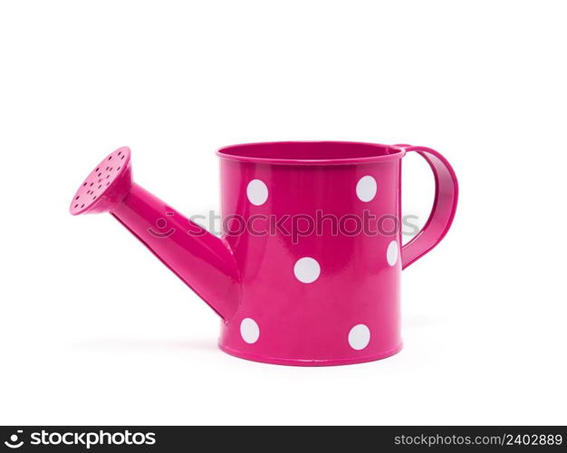 Pink polka dot watering can isolated on white