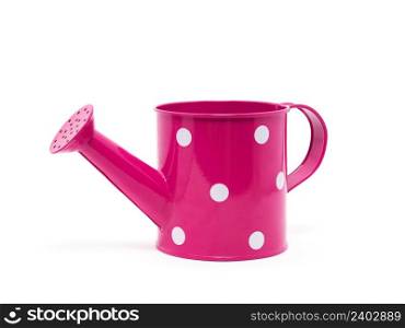 Pink polka dot watering can isolated on white