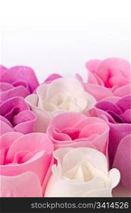 Pink, purple and white beautiful luxury soap roses background.