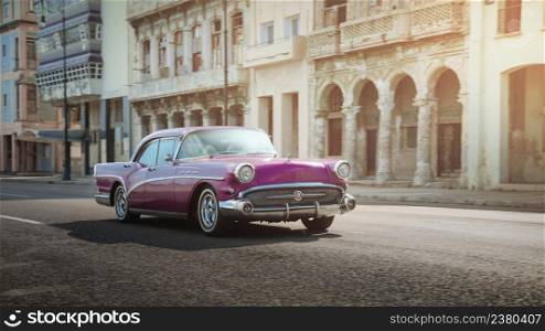 Pink retro car on the street of Havana, Cuba, shot with panning