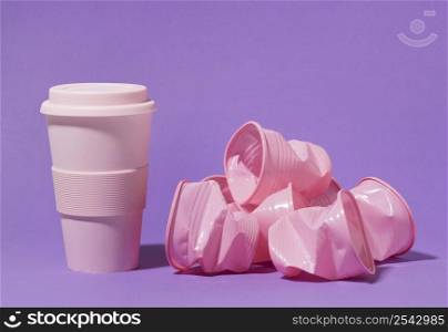pink reusable cup with plastic cups