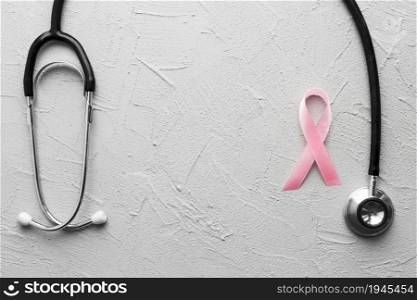 pink ribbon black stethoscope plaster. High resolution photo. pink ribbon black stethoscope plaster. High quality photo