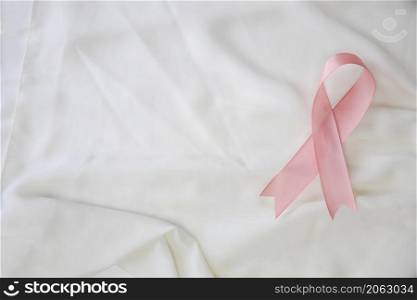 Pink ribbon breast cancer awareness, Health medical concept, satin background copy space. Pink ribbon breast cancer awareness, Health medical concept, satin background