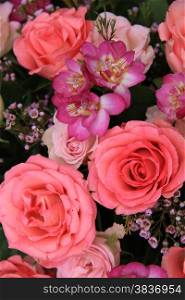 Pink rose and freesia wedding arrangement