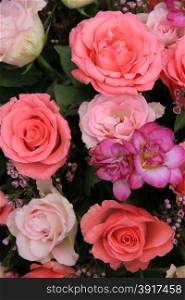 Pink rose and freesia wedding arrangement