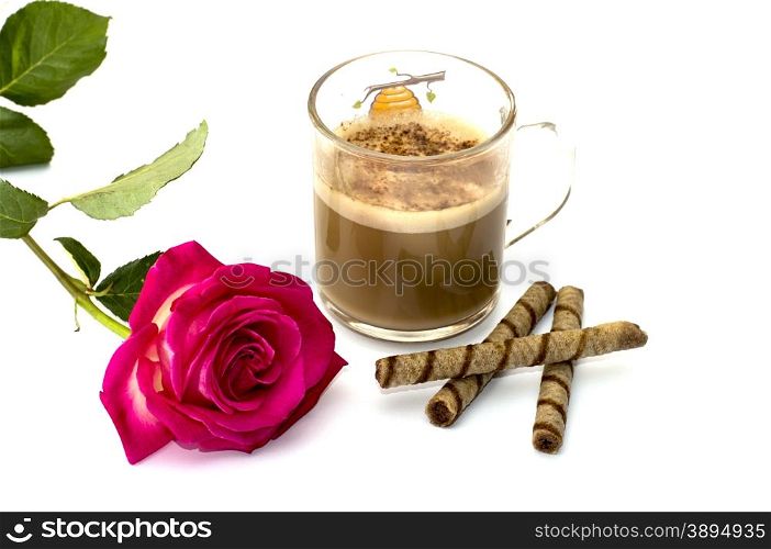 Pink rose and glass of a cappuccino with cookies