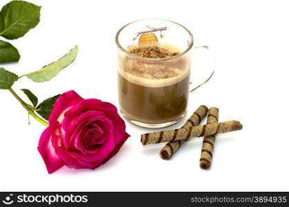 Pink rose and glass of a cappuccino with cookies