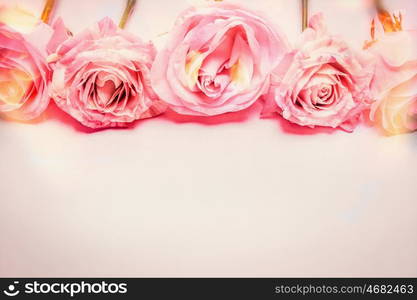 Pink rose floral border with bokeh lighting, pastel color, greeting card