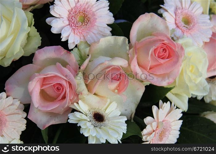pink roses and gerberas in a mixed floral arrangement