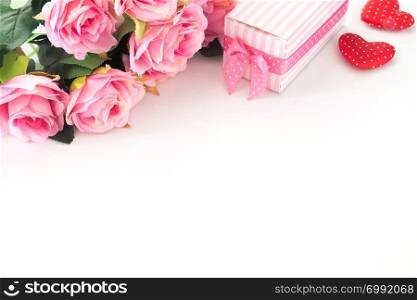 Pink roses, Gift box and heart on white background