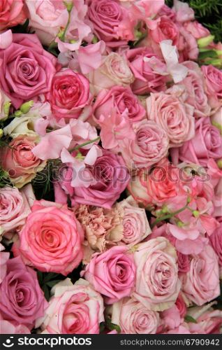 Pink roses in a bridal flower arrangement, centerpiece decorations