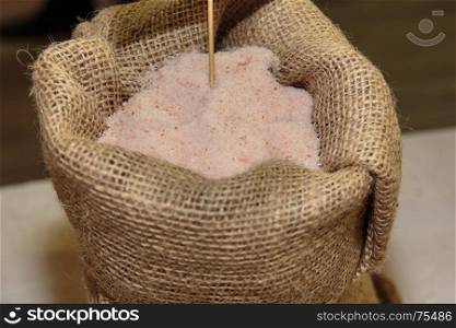 Pink Salt inside Burlap Sack