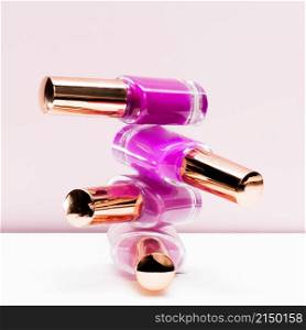 pink shades stacked nail polish bottle