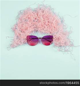 pink shredded paper wig sunglasses mint background. High resolution photo. pink shredded paper wig sunglasses mint background. High quality photo