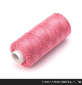 Pink spool of thread isolated on white background