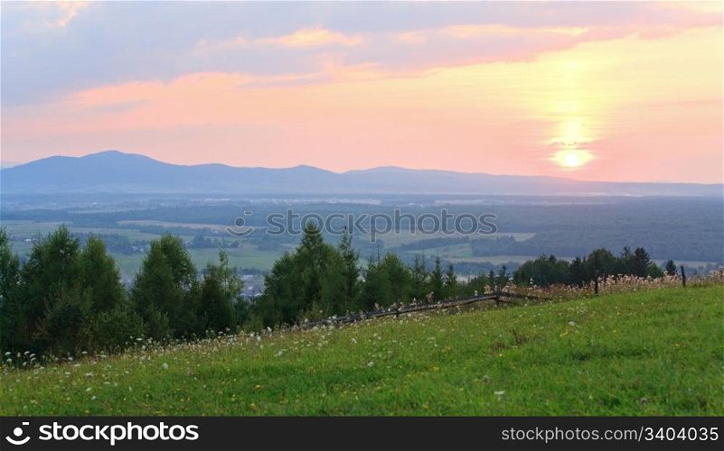 Pink sunset and countryside landscape