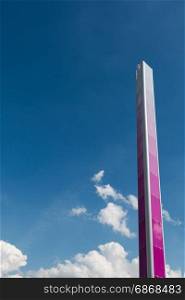 Pink Tall Metallic Column and Blue Sky in background: Architectural Design Structure