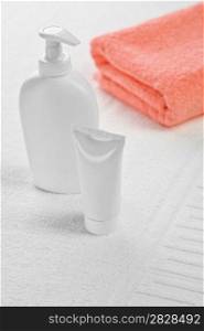 pink towel tube and bottle