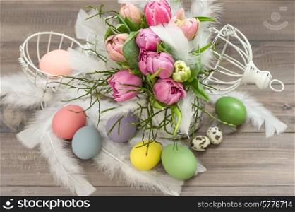 pink tulip flowers and easter eggs. romantic style decoration. selective focus