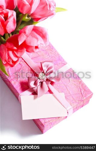 Pink tulips with card and present closeup