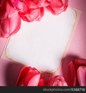 Pink tulips with card closeup