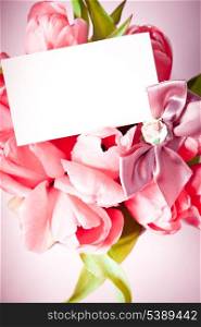 Pink tulips with card closeup